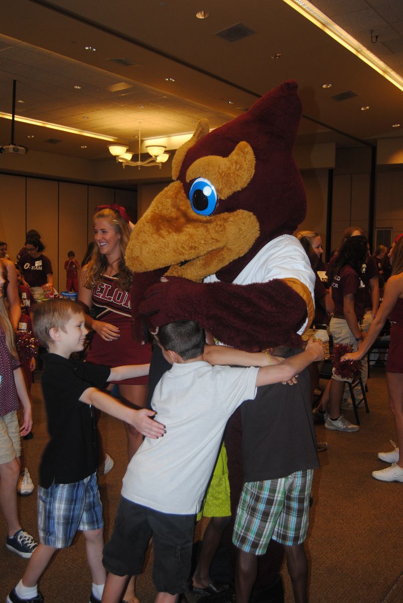 Siblings meet our Elon mascot, the Phoenix